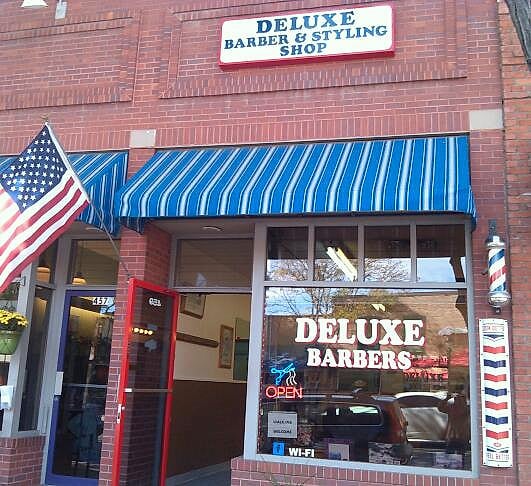 Full facade of the former Deluxe Barber and Styling Shop location at 459 Main Street