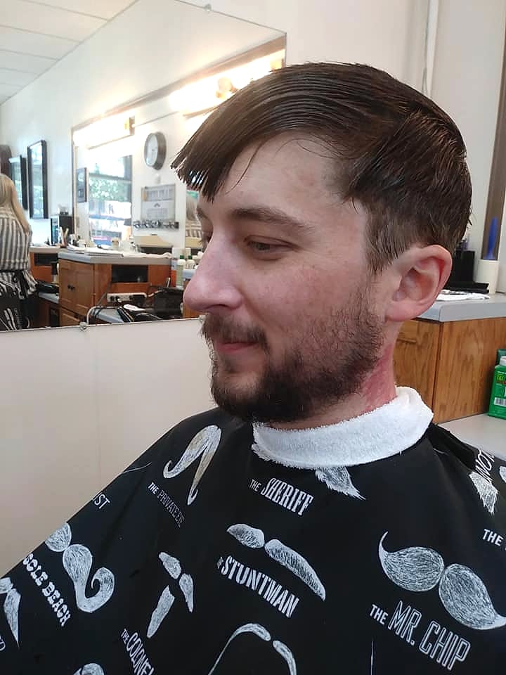 Side profile of a finished short haircut